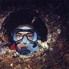 Diver looking out of porthole