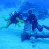 Divers examine ships propeller