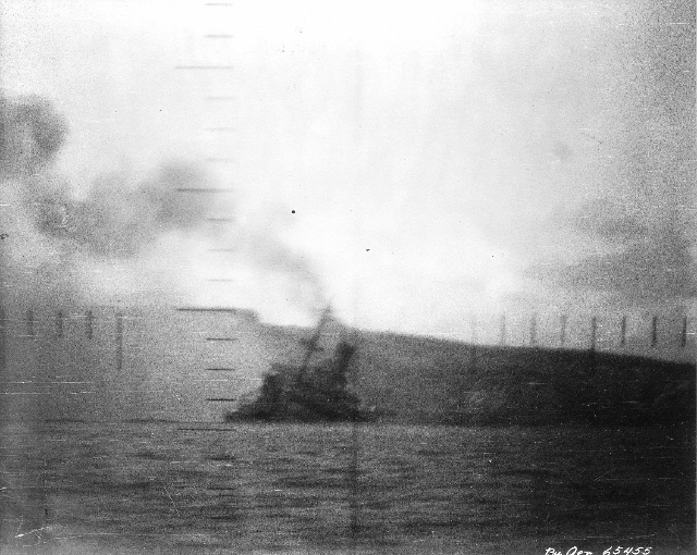 Ship trying to steam away after torpedo hit